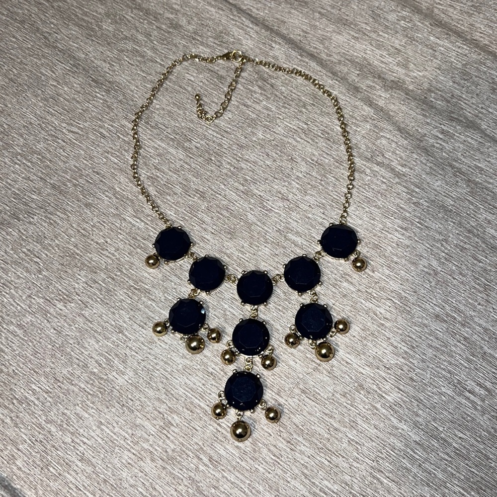 Woman’s necklace with dark blue stones
